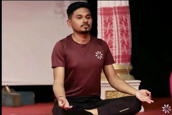 Jyotishman practising yoga